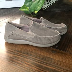 Crocs slide on shoes. Tan size J3